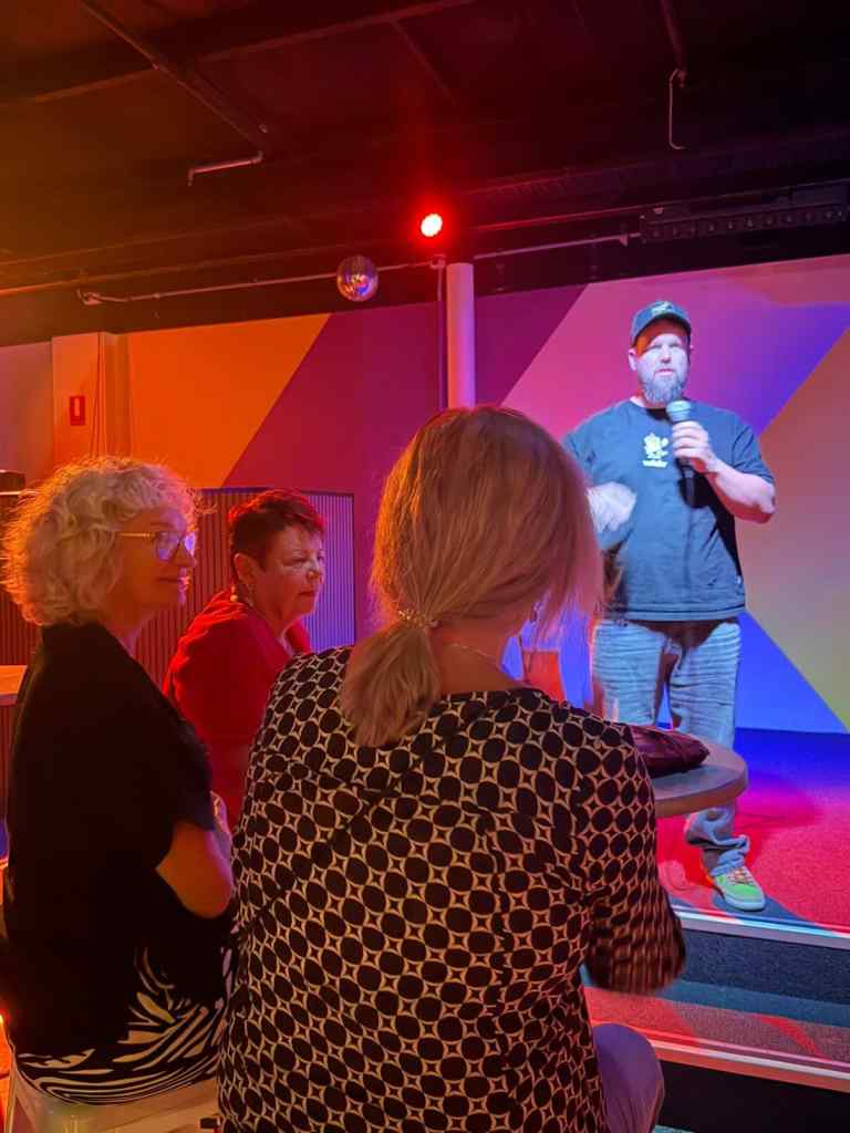 Adelaide comedian Stephen Lockwood is standing on stage with three retired nurses in the front row. You can't tell from the photo but they are smashing the cocktails hard